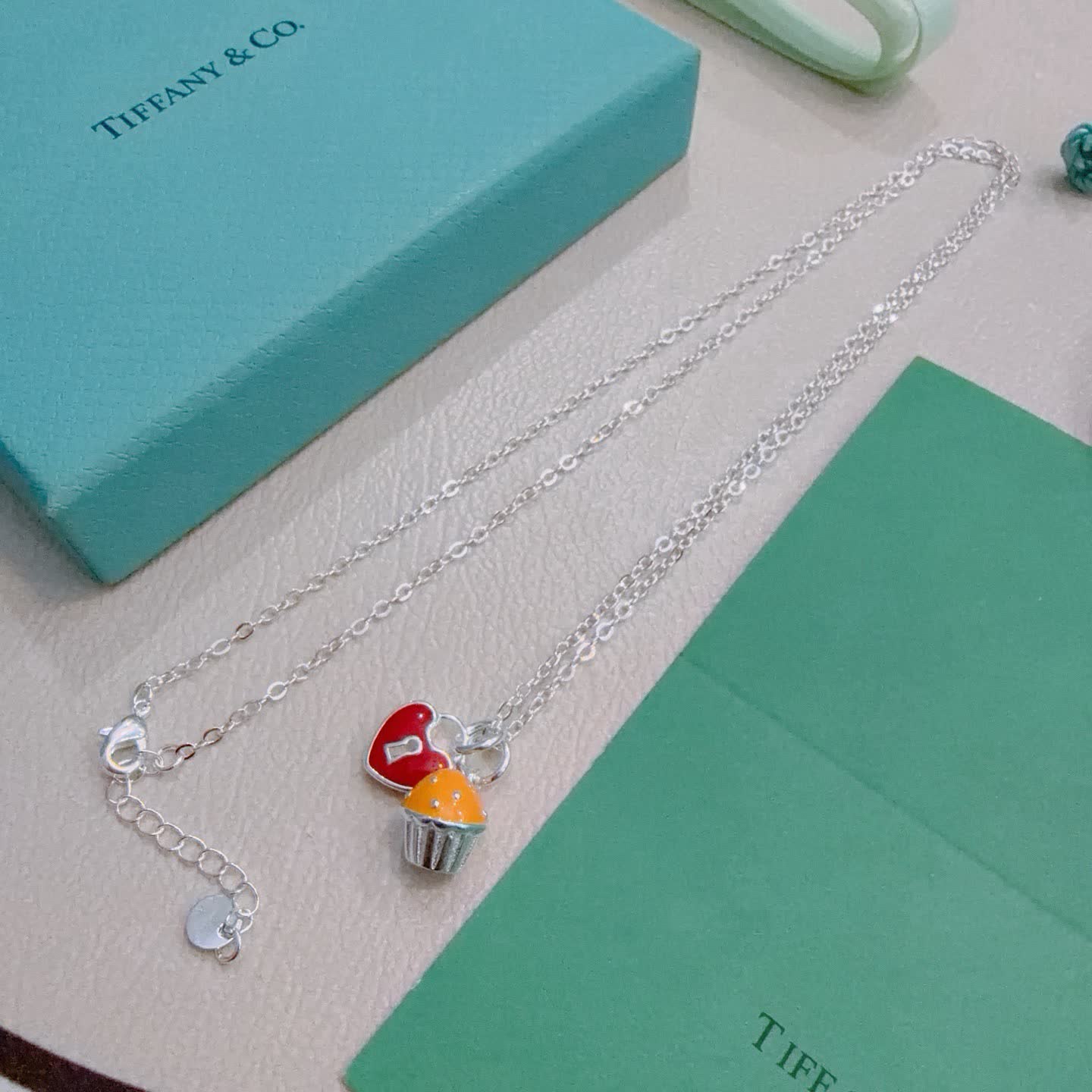 Tiffany & Co. Lock and Key Necklace with Cupcake Charm